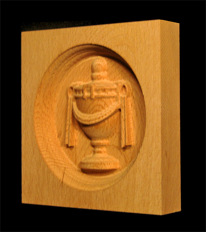 Corner Block - Urn, oval inset.