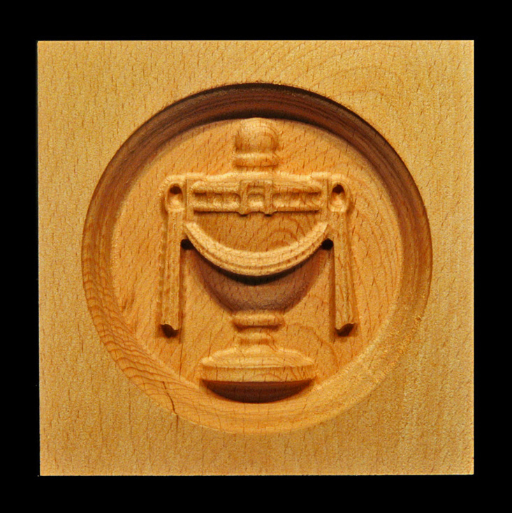 Corner Block - Urn, oval inset.