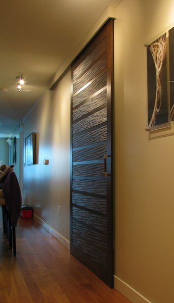 sliding barn door using tg-3d paneling cabinetry and doors