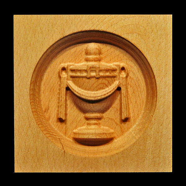 Image Corner Block - Urn, oval inset.